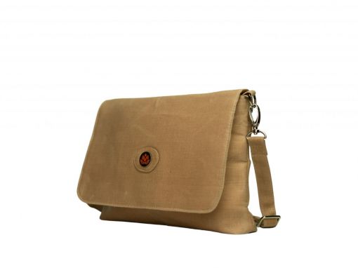 Front side view of Sahara hemp leather crossbody bag in Hazelnut brown with protea medallion