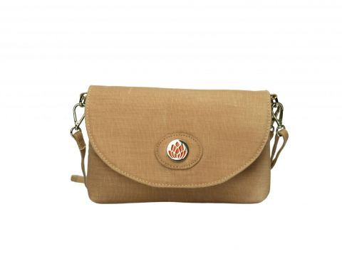 Front view of crossbody clutch bag with protea medallion in hazelnut tan